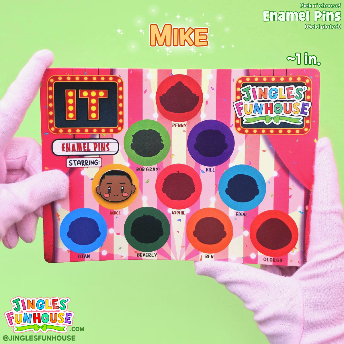 A hard enamel pin of Mike Hanlon (from the movie "IT") attached onto a colorful backing card. 

The size of the pin is approximately 1 inch.

Made by Jingles' Funhouse.